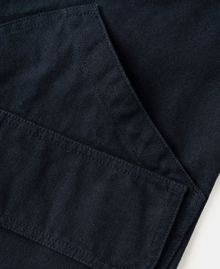 Navy jacket angled side pocket seam detail