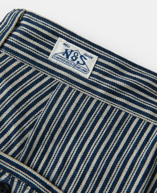 Striped trousers brand label, V&S with size 32, blue and off-white pinstripes.