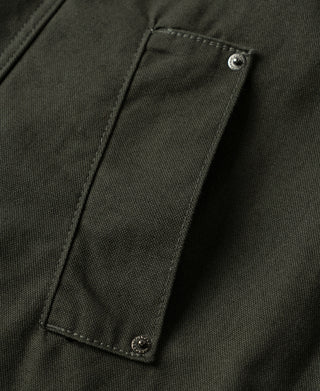 Olive canvas jacket sleeve pocket with button flap and stitched edging
