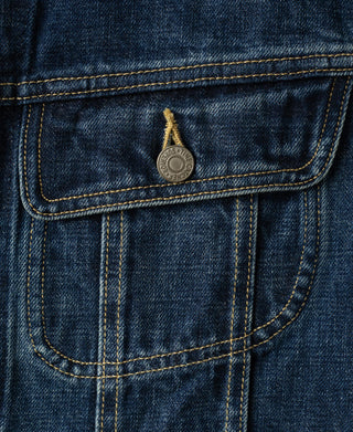 Indigo denim jacket flap pocket with metal snap button and outlined stitching