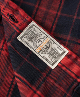 Red and dark navy plaid work shirt care label inside neckline placket