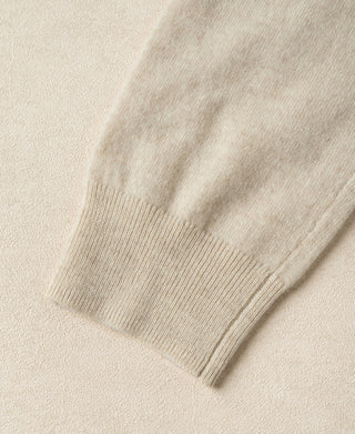 Apricot merino wool sweater sleeve with ribbed cuff.