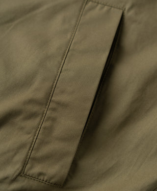 Khaki harrington jacket front panel seam detail with vertical edge stitching