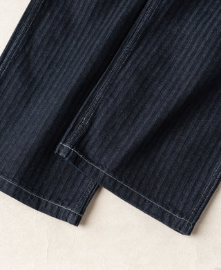 Indigo pinstripe denim pants with side hem stitching and straight leg opening