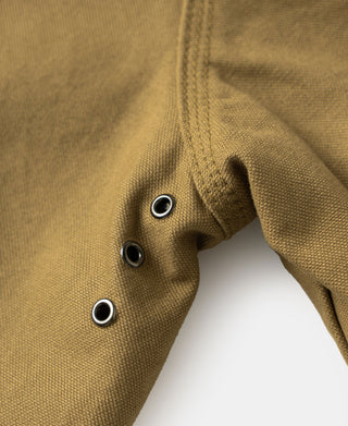 Khaki canvas field jacket sleeve cuff with metal eyelet snaps