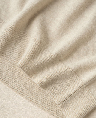 Apricot merino wool sweater knit texture with ribbed finish detail.