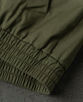 Olive Harrington jacket hem with gathered elastic and smooth outer finish