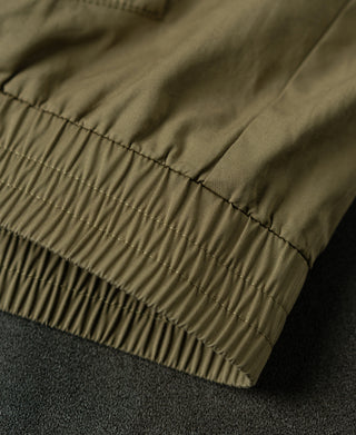 Khaki harrington jacket sleeve hem with elastic ribbing and stitched seam