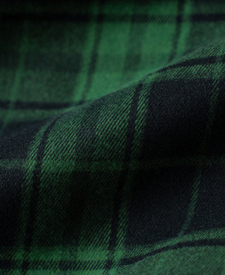 Green and dark plaid woven fabric close-up