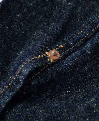 Indigo denim jacket close-up of top button on the stand collar