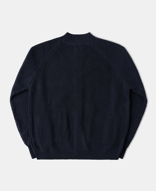 Back view of a heavyweight dark blue wool-blend cardigan sweater with a structured knit silhouette.