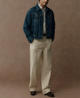 Indigo denim jacket with pointed collar, button front, chest pockets and contrast stitching