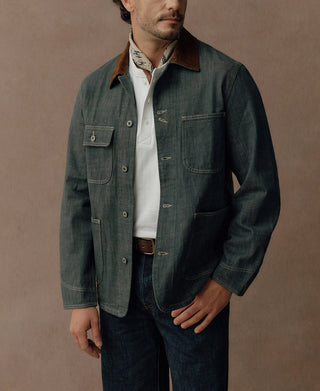 Sage blue four-pocket denim jacket with contrast brown collar and metal button closures