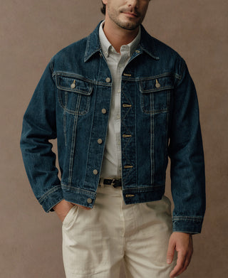 Indigo denim jacket with flap chest pockets, metal buttons and contrast stitching