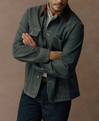 Denim barn jacket with four pockets, contrast collar, and curved hem