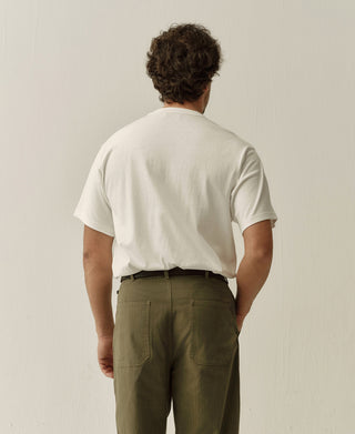 White boxy T-shirt shown from the back, with short sleeves and a crew neck.