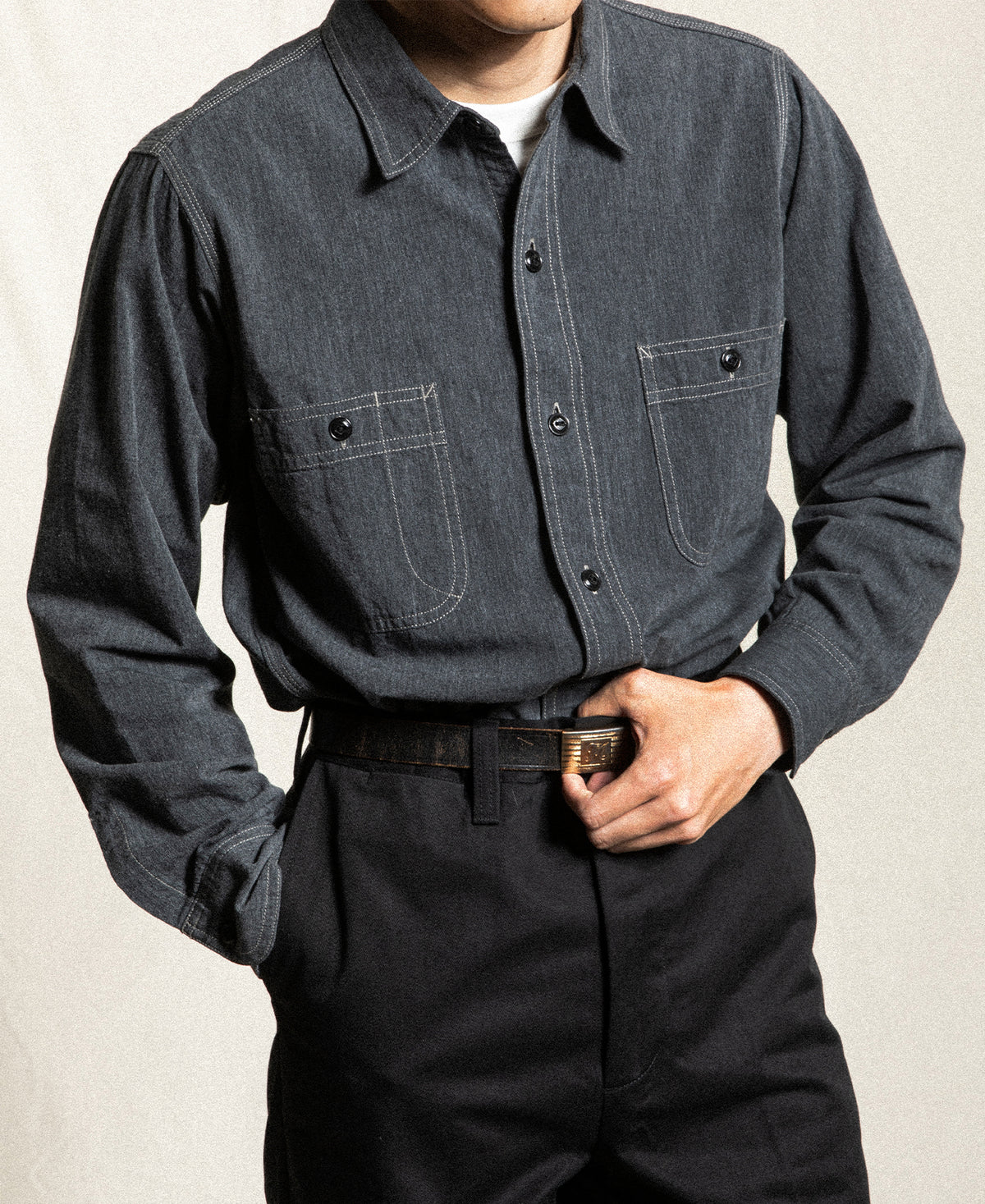 Dark gray chambray work shirt with two chest pockets and button front