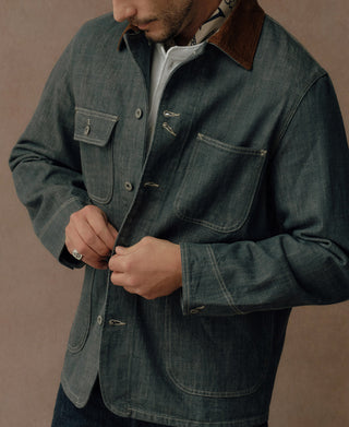 Four-pocket denim jacket featuring contrast stitching and metal hook-and-eye closures
