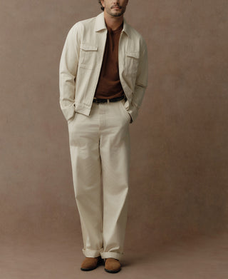 Natural heavyweight cotton Eisenhower jacket shown with a relaxed fit and two chest pockets.