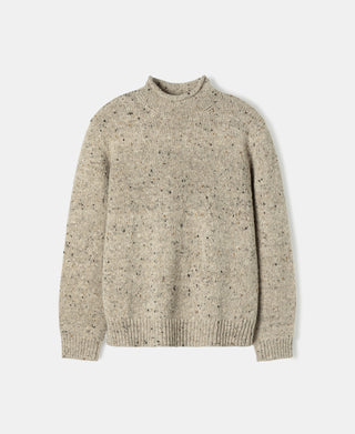 Front view of an ecru pure wool fisherman sweater featuring a roll neck and classic rib knit design.