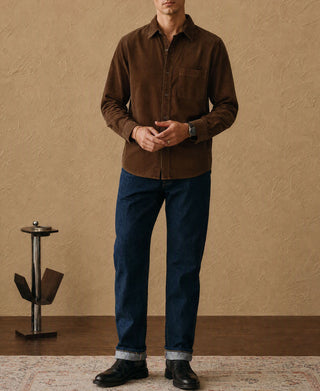 Brown cotton corduroy button-up shirt worn with jeans