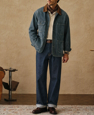 Sage blue denim barn jacket with brown corduroy collar over jeans