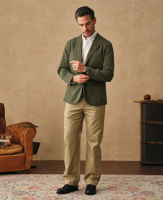 Olive herringbone blazer with notched lapels and front buttons, long sleeves