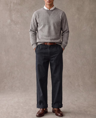 Navy deck trousers on a model with straight legs and cuffed hem