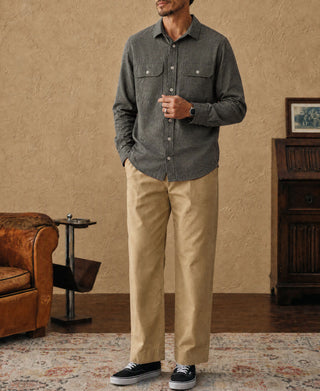 Dark gray brushed cotton flannel work shirt worn with tan pants and sneakers, full front