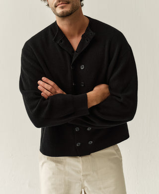 Black knit cardigan with double-breasted button front and stand collar