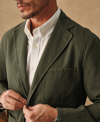 Olive blazer front pocket and collar detail with single button closure