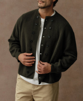 Olive knit cardigan with double-breasted button front and ribbed cuffs and hem