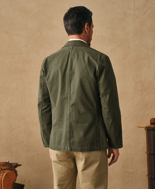 Olive herringbone blazer back view with center vent and structured shoulder seams